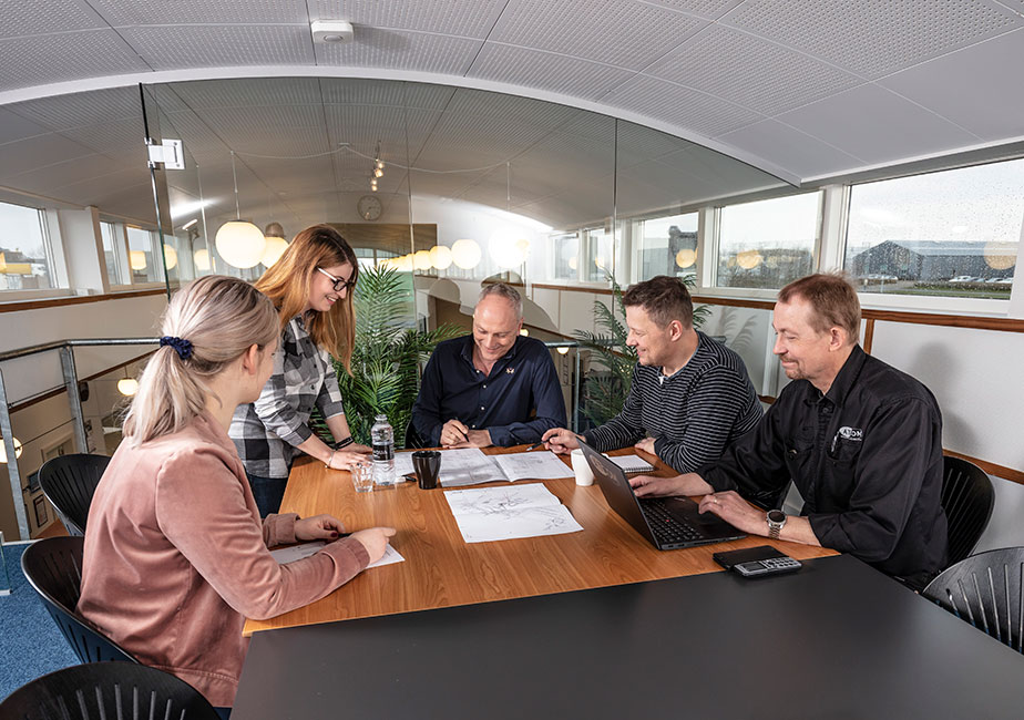 ATCOM team reviewing project drawings