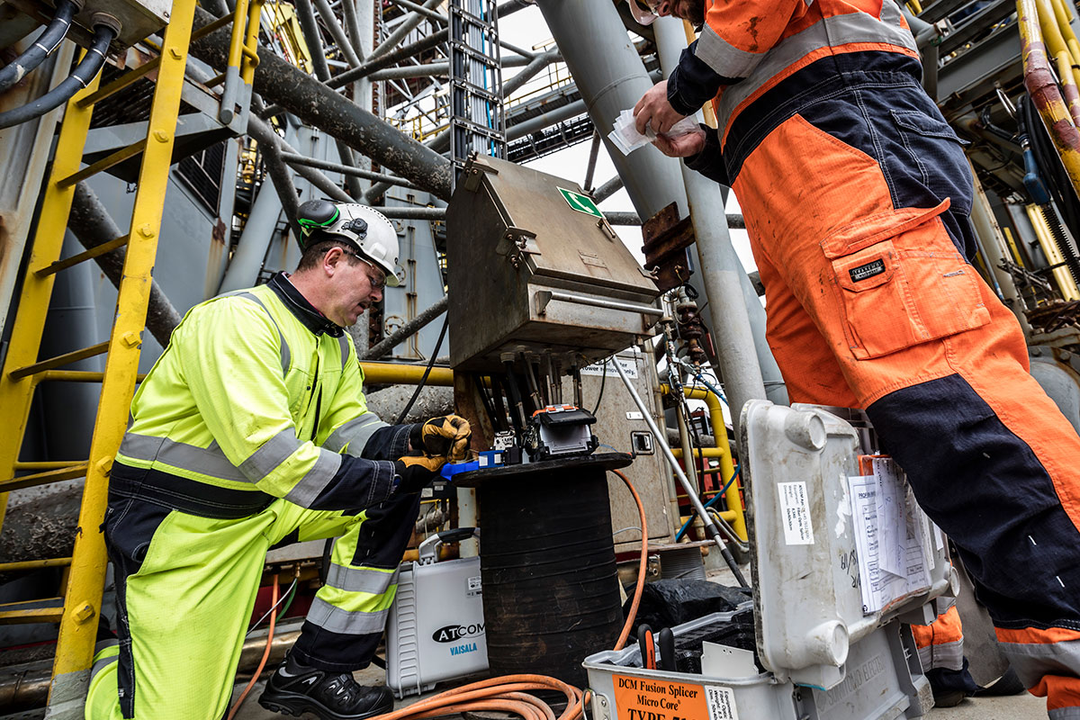 Engineer installing offshore telecom equipment