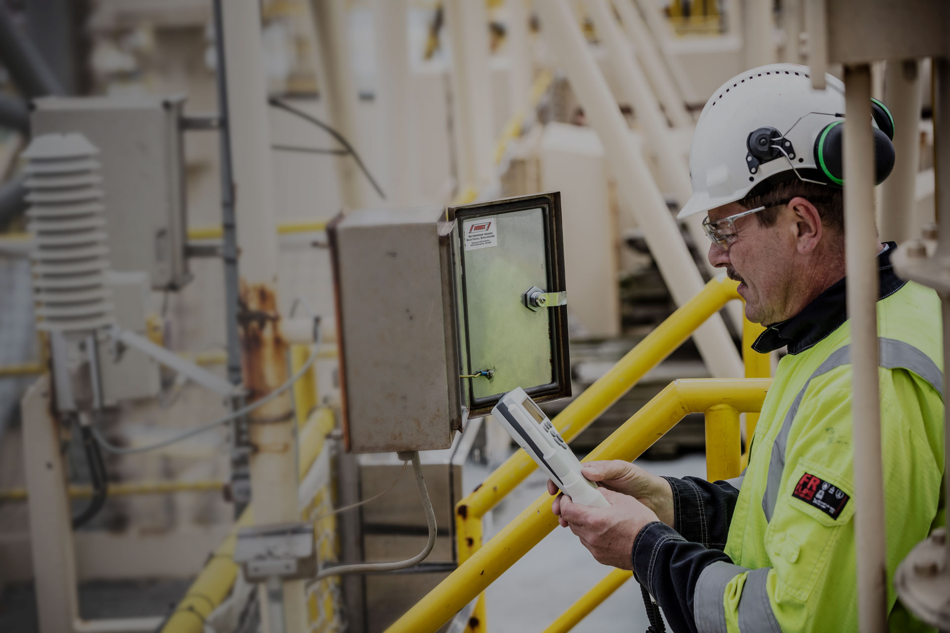 Engineer monitoring operational technology equipment